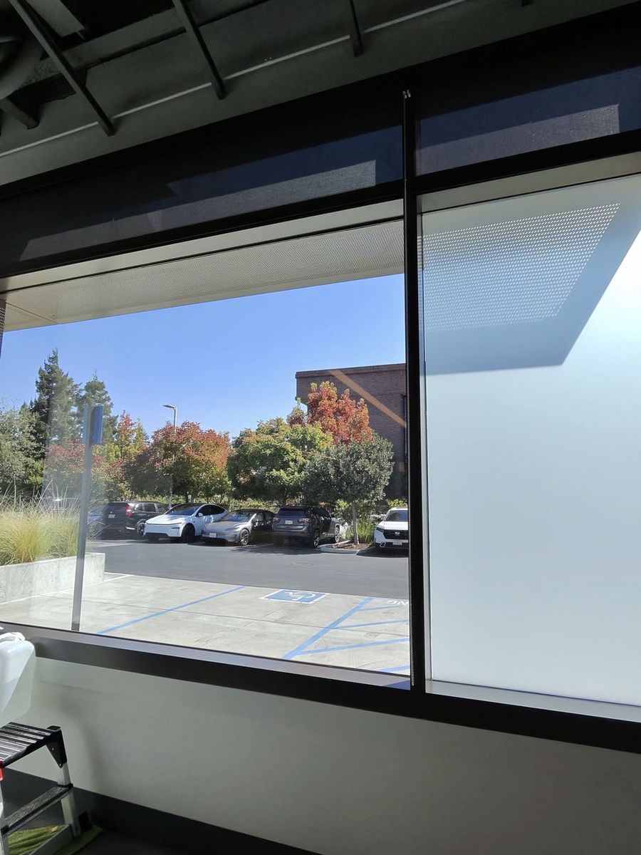 Office glass with privacy film beside clear glass