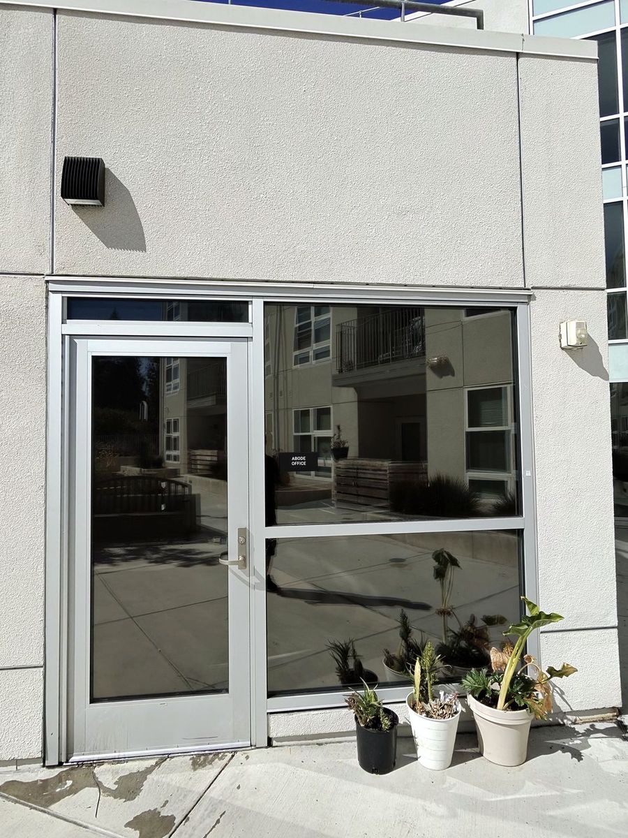 Dark reflective window film on a San Jose office exterior